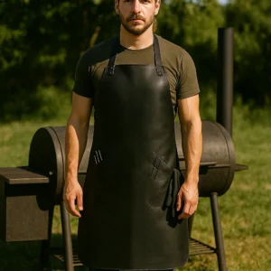 a bbq men wearing leather bbq apron outdoors